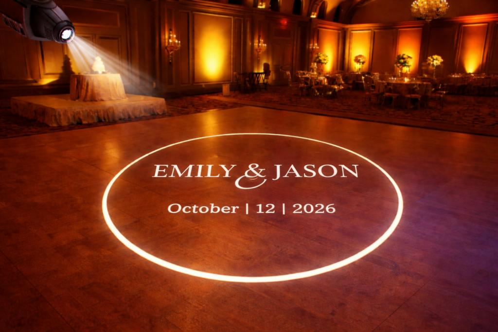 wedding monogram light, custom wedding monogram, gobo monogram projection, wedding dance floor monogram, personalized wedding lighting, monogram lighting service, wedding gobo light, custom name projection wedding, elegant wedding lighting, reception lighting ideas, wedding uplighting and monogram, projected monogram wedding, ballroom wedding lighting, luxury wedding decor, wedding reception dance floor, custom wedding names projection, wedding spotlight monogram, overhead gobo projector, crisp white monogram projection, wedding lighting rental maryland, baltimore wedding lighting, maryland wedding monogram, picture this parties monogram, wedding decor lighting enhancement