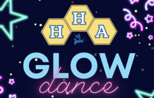 Guests enjoying glow night party photo booth with neon lighting on April 24, 2026